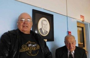 Sheri Samson Gary Funk (left) stands next to his father’s rendering that he created, as Arlo Funk, his father, smiles approvingly.